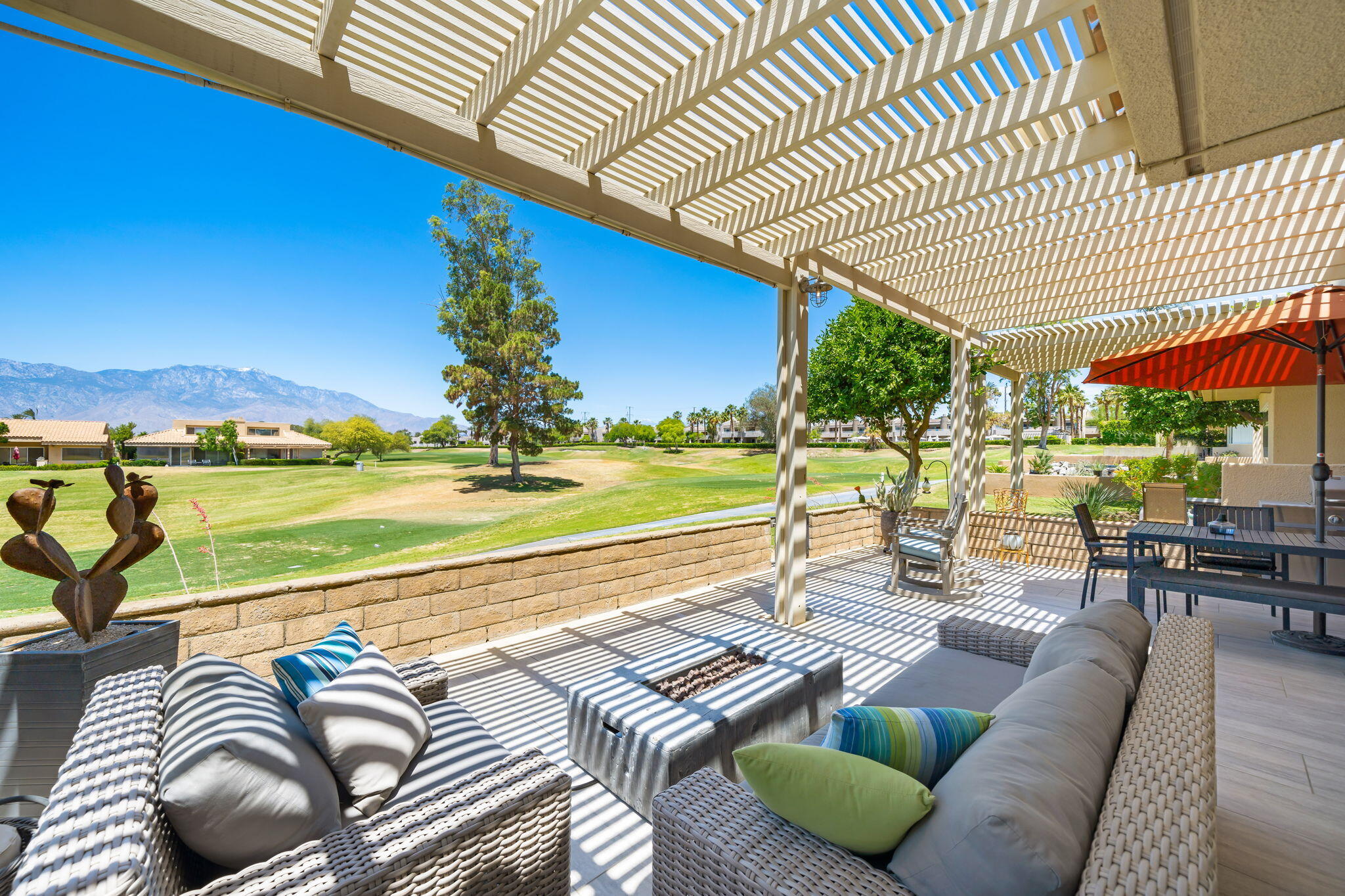 93 Augusta Drive Rancho Mirage, CA 92270 - Photo 3 of 39 a view of a patio with couches chairs and a table and chairs