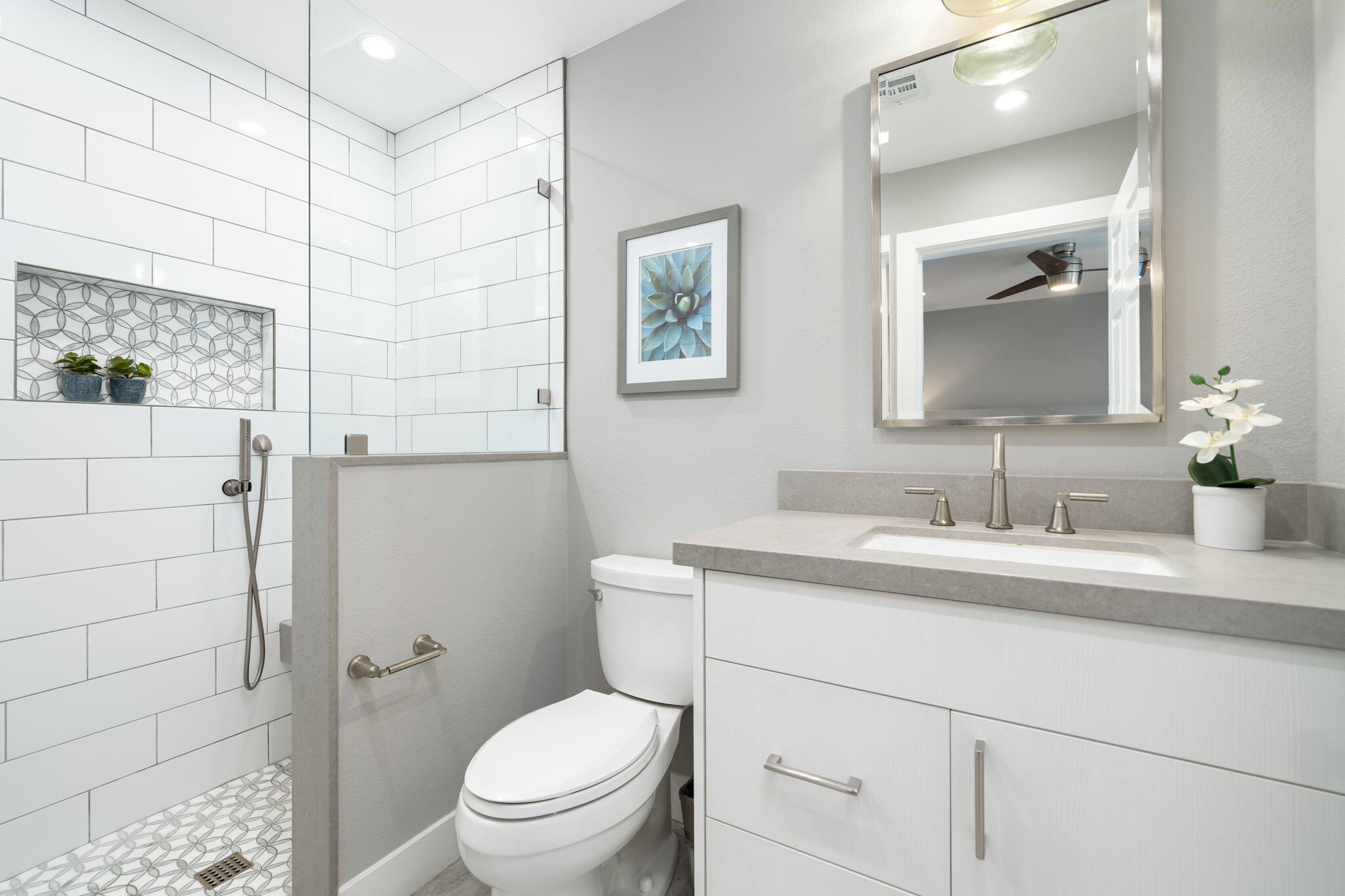 93 Augusta Drive Rancho Mirage, CA 92270 - Photo 33 of 39 a bathroom with a toilet a sink a shower and a mirror
