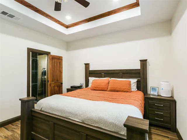 a bedroom with a bed and a dresser