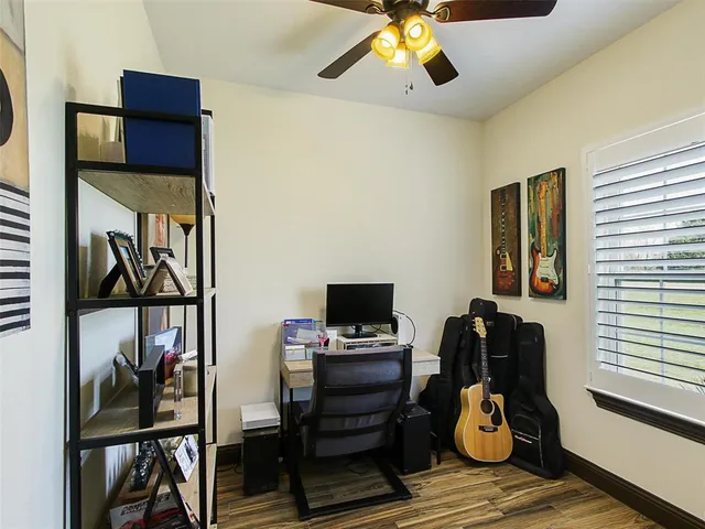 a bedroom with furniture and a window