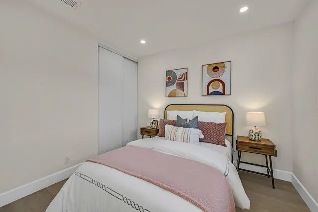 a bedroom with a bed and a table in it