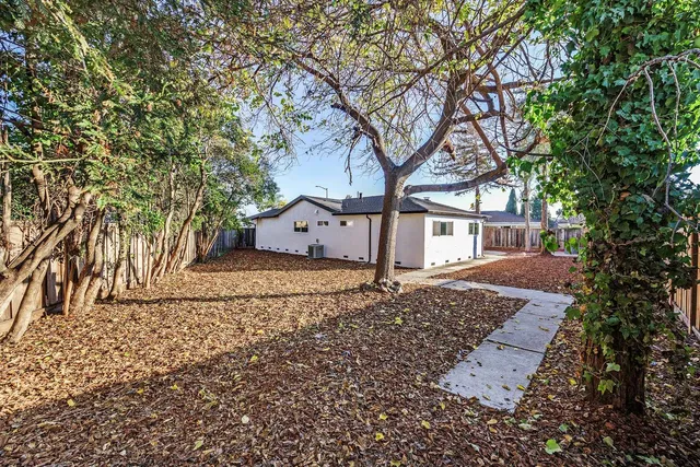 a house with trees in front of it
