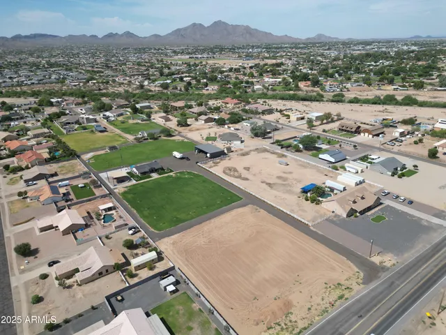 an aerial view of a residential houses with outdoor space