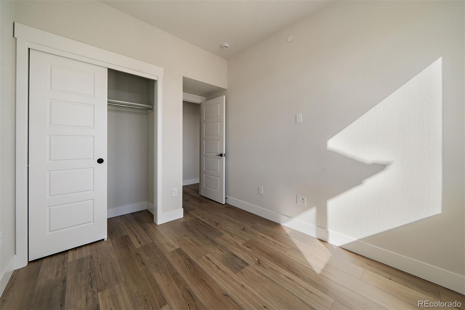 10882 Lyric Street Parker, CO 80134 - Photo 17 of 25 wooden floor in an empty room