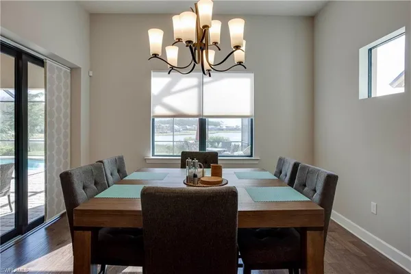 a dining room with furniture and window