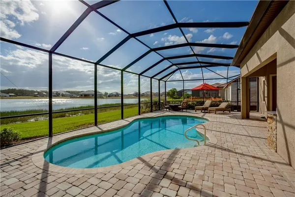 a view of a swimming pool with a porch