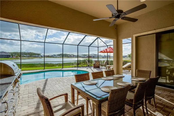 a view of a dining room with furniture window and outside view