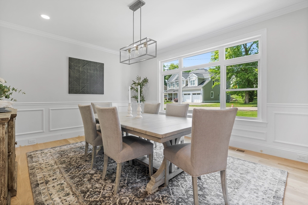 103 Wayne Road Needham, MA 02494 - Photo 12 of 29 a view of a dining room with furniture window and wooden floor