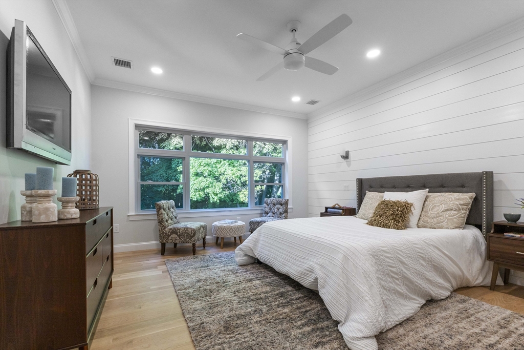 103 Wayne Road Needham, MA 02494 - Photo 15 of 29 a bedroom with a large bed and a large window