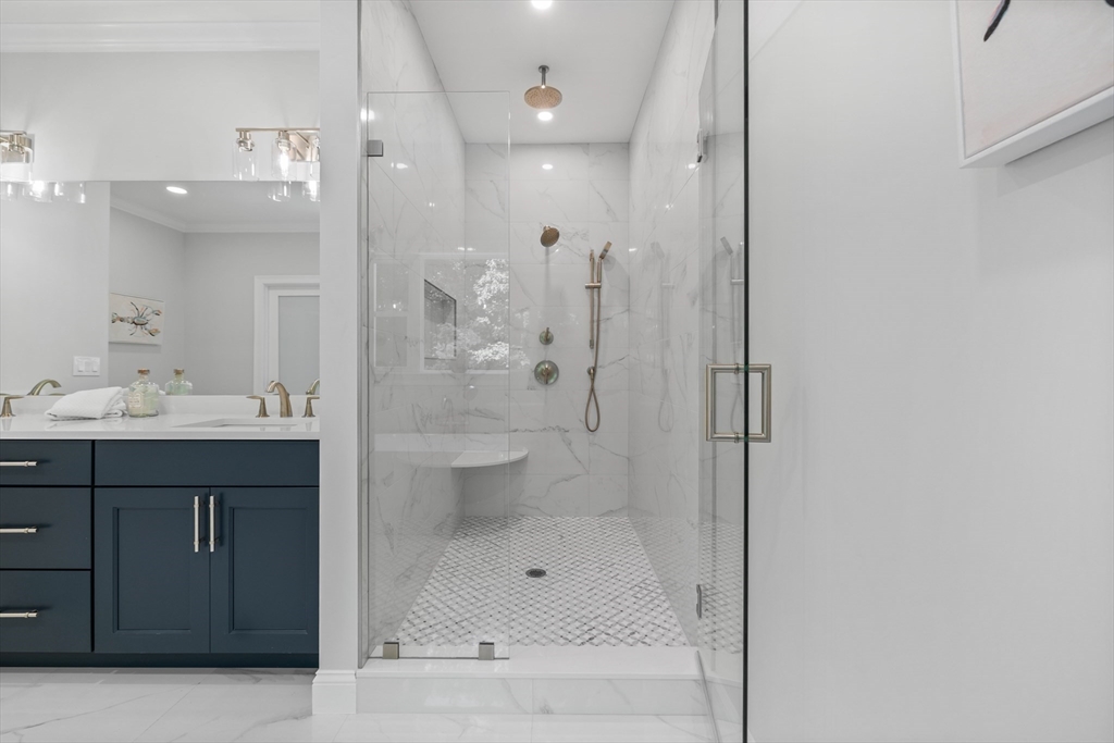 103 Wayne Road Needham, MA 02494 - Photo 16 of 29 a bathroom with a shower a sink and a mirror