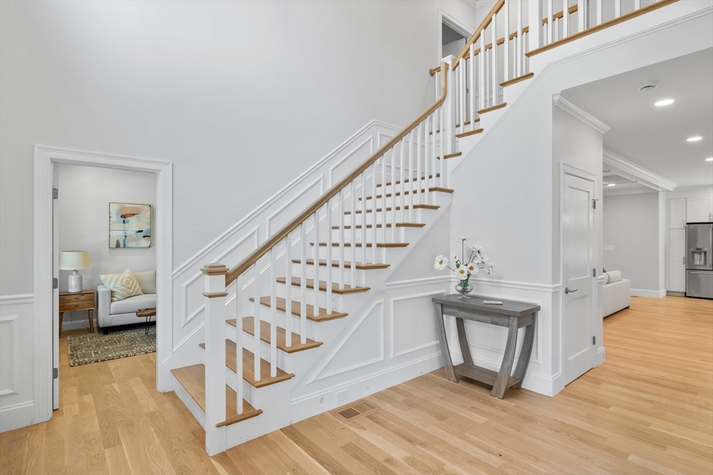 103 Wayne Road Needham, MA 02494 - Photo 2 of 29 a view of entryway and hall with wooden floor