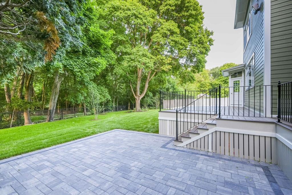 103 Wayne Road Needham, MA 02494 - Photo 24 of 29 a view of a backyard with a garden