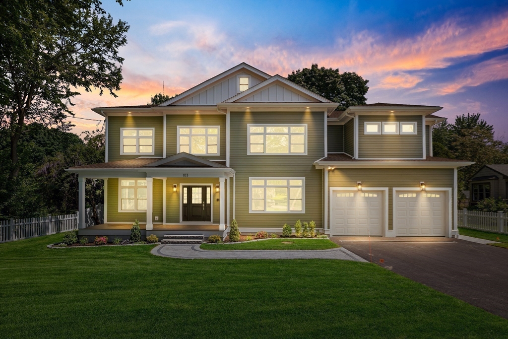 103 Wayne Road Needham, MA 02494 - Photo 29 of 29 a front view of a house with a yard and garage