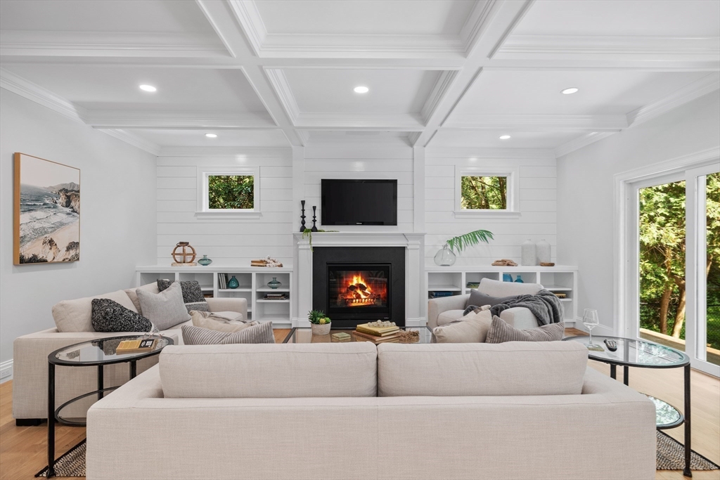 103 Wayne Road Needham, MA 02494 - Photo 8 of 29 a living room with furniture a fireplace and a flat screen tv