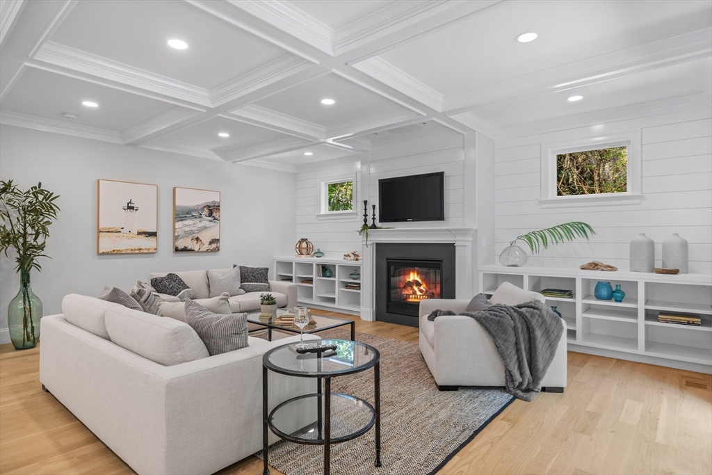 103 Wayne Road Needham, MA 02494 - Photo 9 of 29 a living room with furniture and a fireplace