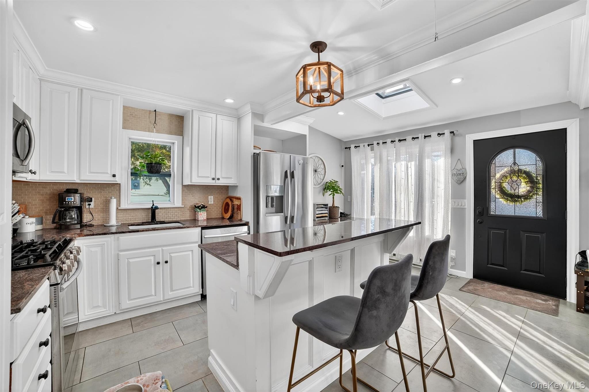40 Orchard Road Putnam Valley, NY 10579 - Photo 12 of 19 a kitchen with stainless steel appliances granite countertop a refrigerator and a stove top oven