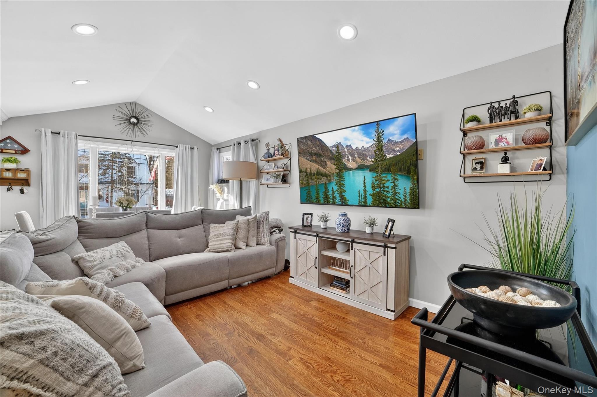 40 Orchard Road Putnam Valley, NY 10579 - Photo 8 of 19 a living room with furniture a flat screen tv and a large window