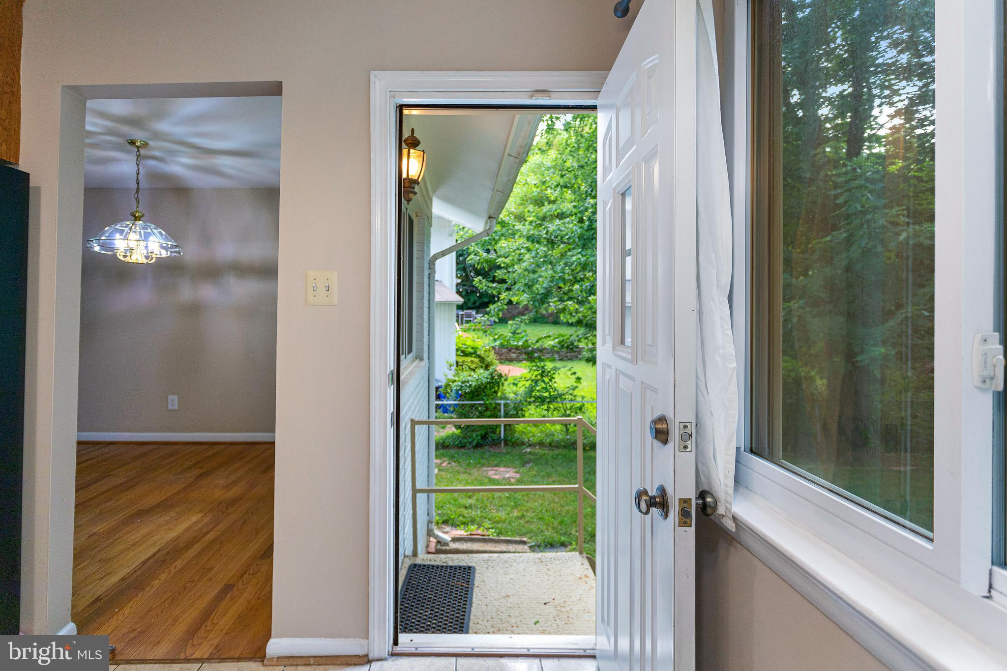 6503 Friars Court Bethesda, MD 20817 - Photo 13 of 48 a view of a glass door and a yard from a window