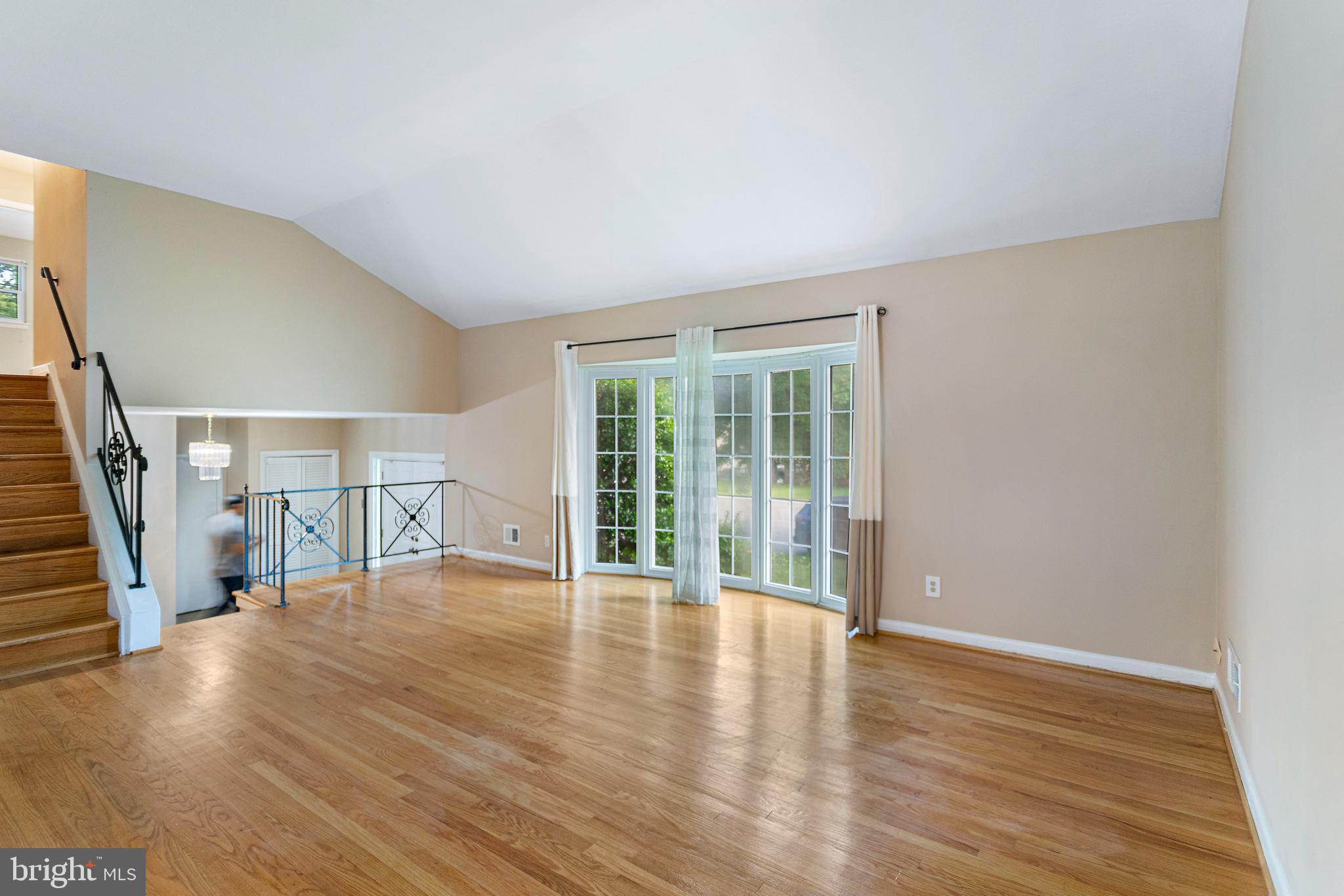 6503 Friars Court Bethesda, MD 20817 - Photo 15 of 48 a view of empty room with wooden floor and fan