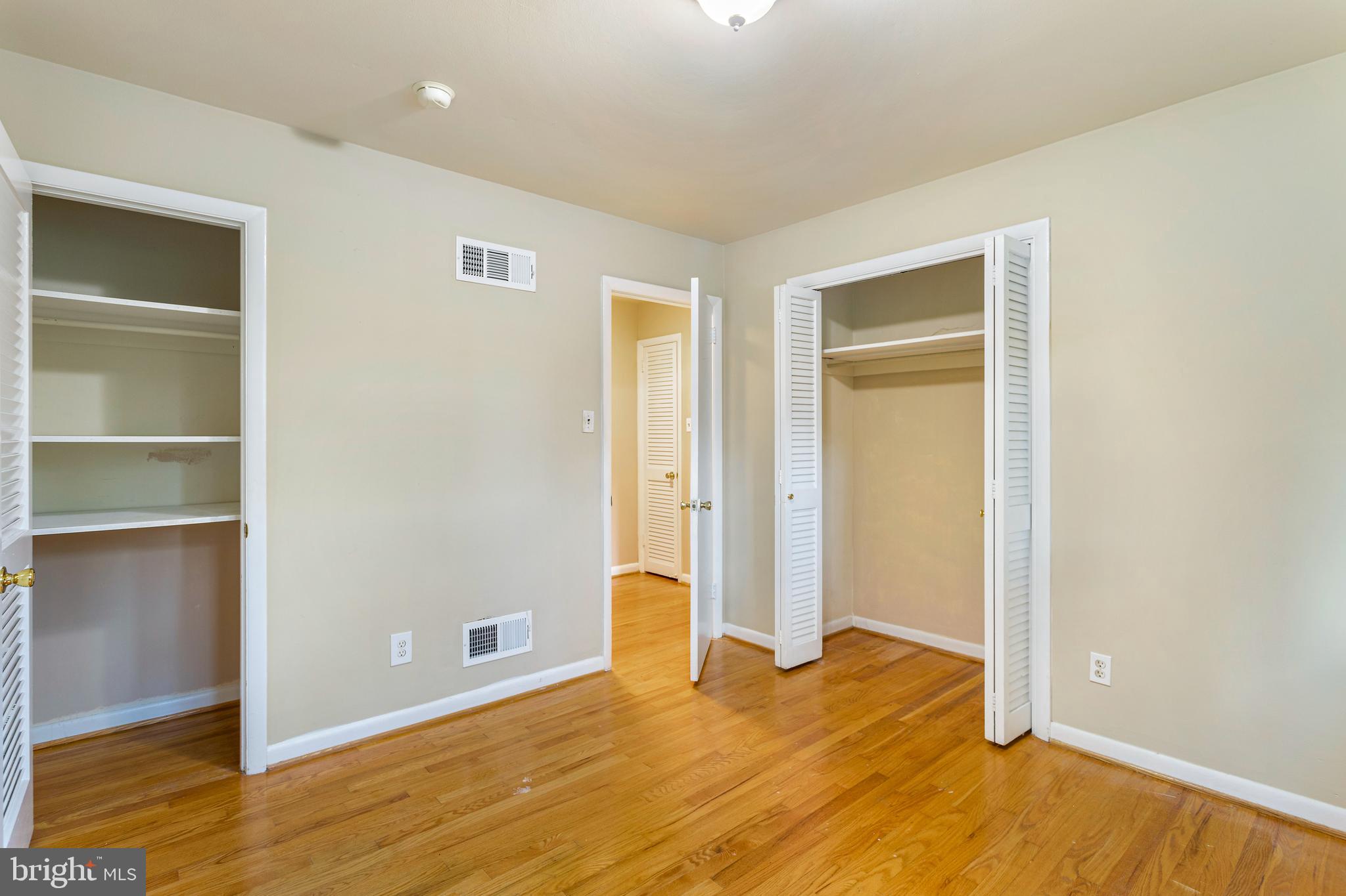 6503 Friars Court Bethesda, MD 20817 - Photo 29 of 48 a view of an empty room with wooden floor and closet