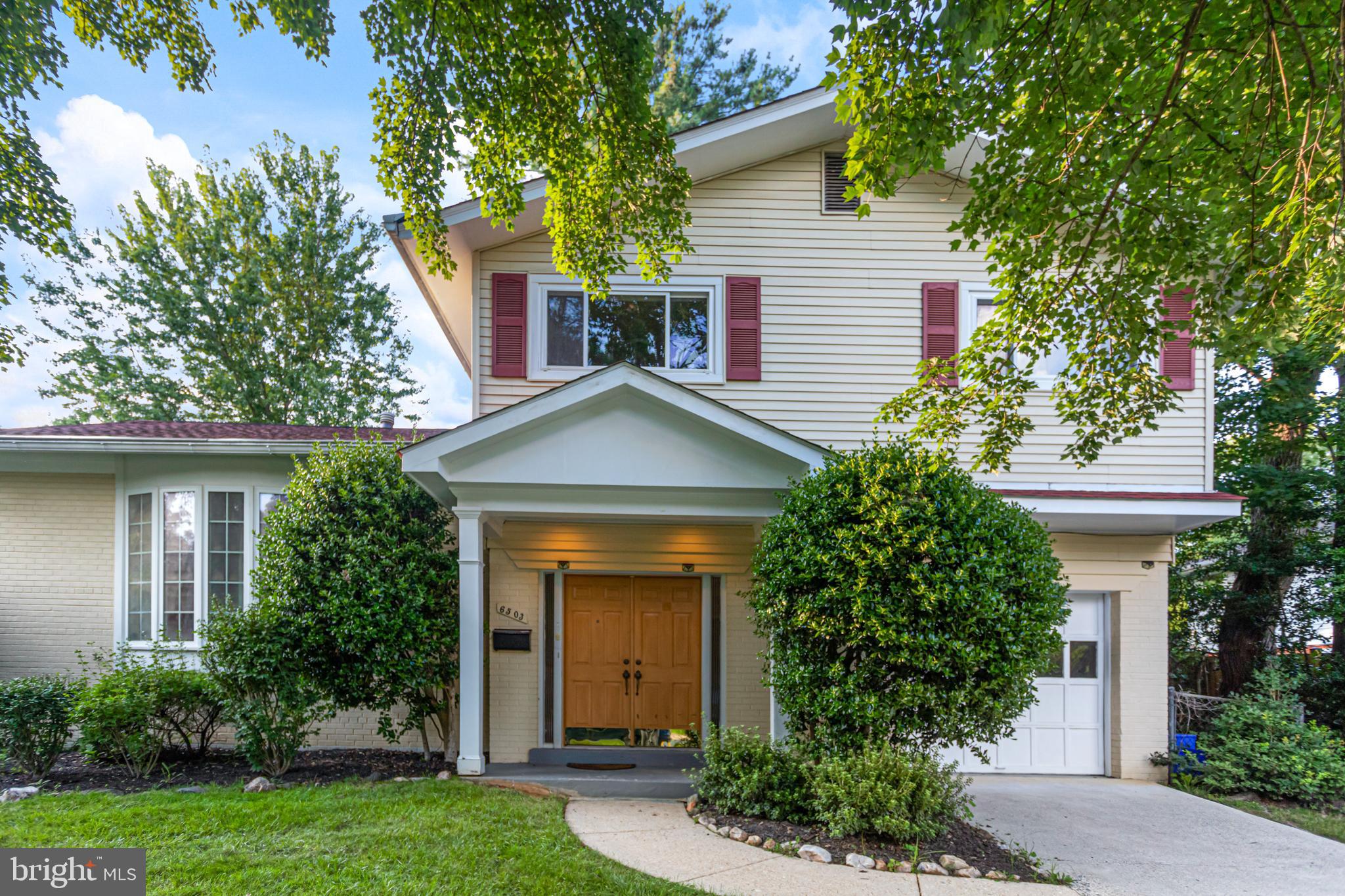 6503 Friars Court Bethesda, MD 20817 - Photo 3 of 48 front view of a house with a yard and trees