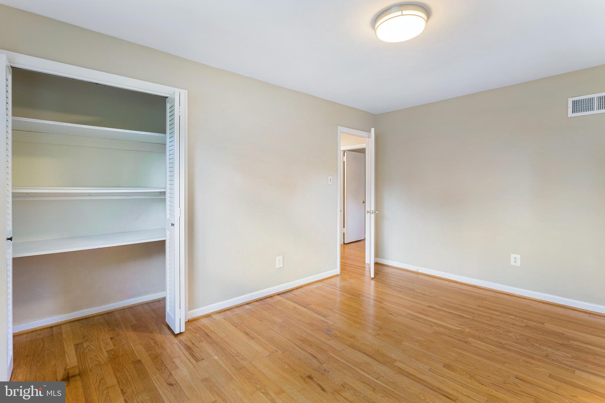 6503 Friars Court Bethesda, MD 20817 - Photo 31 of 48 a view of an empty room with wooden floor