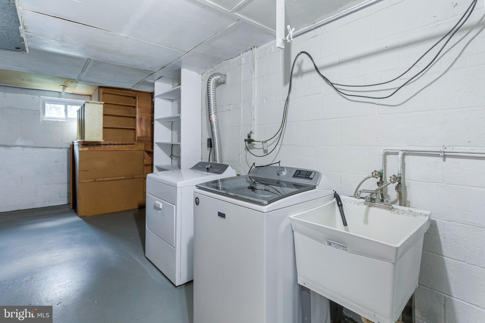 6503 Friars Court Bethesda, MD 20817 - Photo 38 of 48 a utility room with dryer and washer