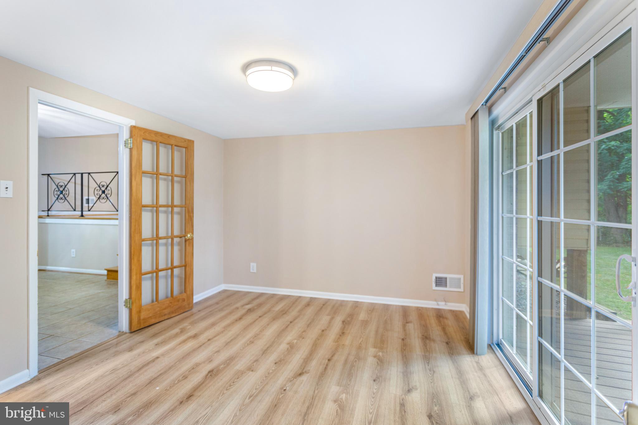 6503 Friars Court Bethesda, MD 20817 - Photo 40 of 48 wooden floor in an empty room with a window
