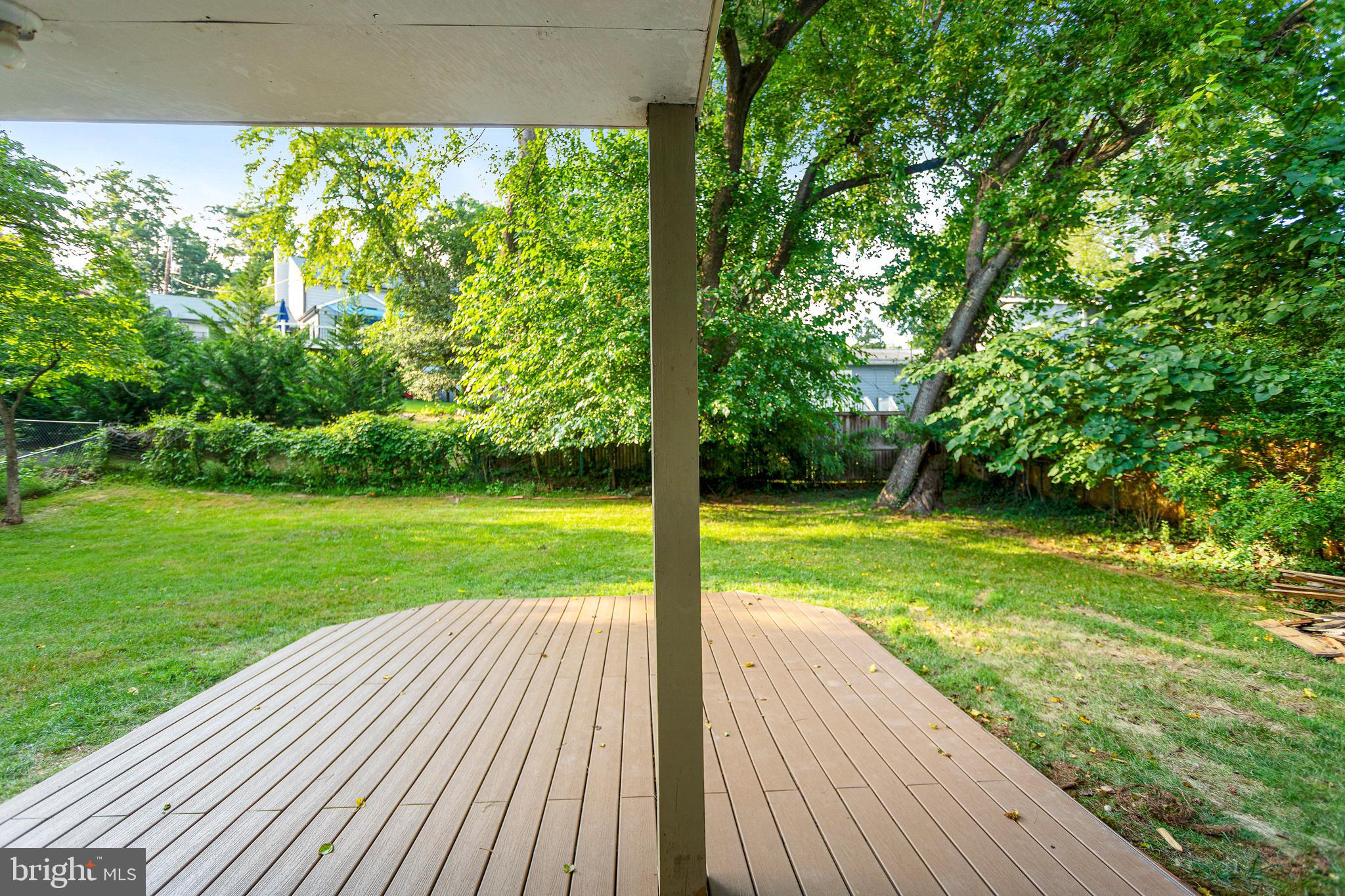 6503 Friars Court Bethesda, MD 20817 - Photo 41 of 48 a view of a wooden deck with a yard