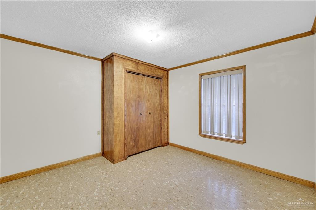 18 Bellas Lane Rio Grande City, TX 78582 - Photo 11 of 28 an empty room with windows and closet