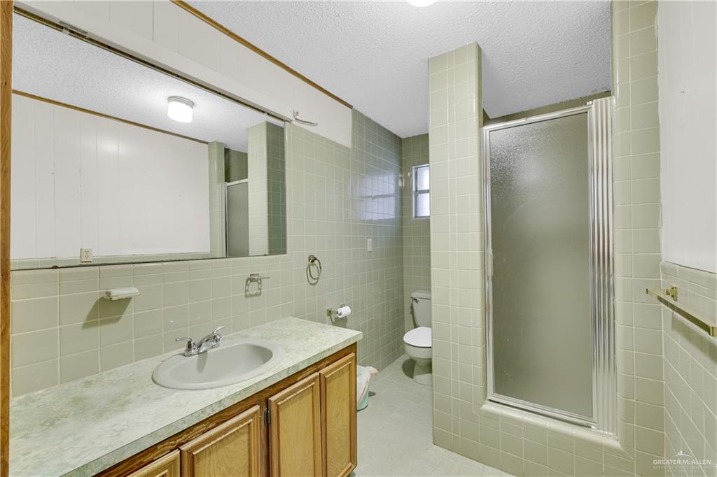 18 Bellas Lane Rio Grande City, TX 78582 - Photo 12 of 28 a bathroom with a sink and a mirror