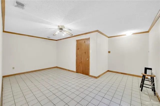 a front view of a house with a garden and yard