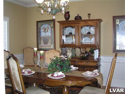 778 Lahr Road Nazareth, PA 18064 - Photo 14 of 36 a view of a dining room with furniture a chandelier and wooden floor