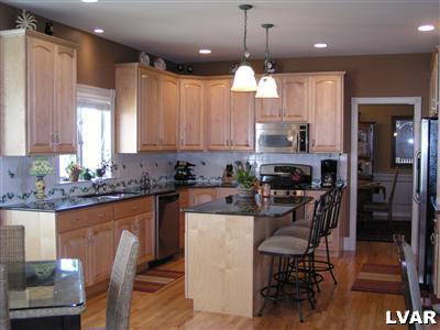 778 Lahr Road Nazareth, PA 18064 - Photo 17 of 36 a kitchen with kitchen island granite countertop a sink a center island and stainless steel appliances