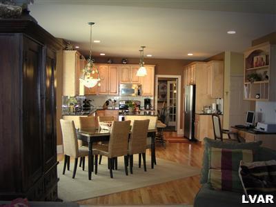 778 Lahr Road Nazareth, PA 18064 - Photo 7 of 36 a dining room with stainless steel appliances kitchen island granite countertop a dining table chairs and a refrigerator