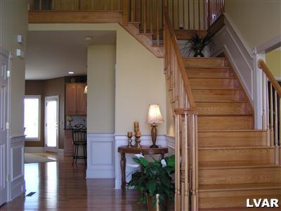 778 Lahr Road Nazareth, PA 18064 - Photo 9 of 36 a view of a hallway with wooden floor and staircase