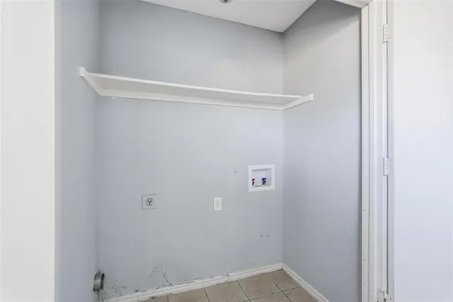 a view of a brick house with a yard