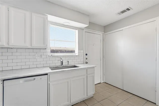 a picture of a bench in front of a wall