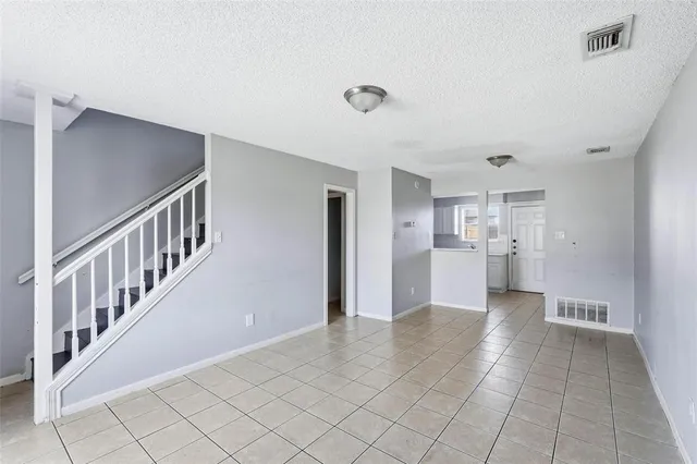 a view of a hallway with kitchen and sink