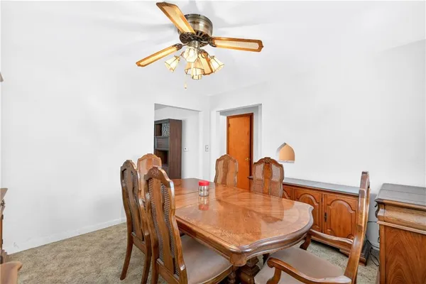 a dining room with furniture and window