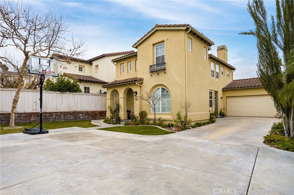 4 Skywood Street Ladera Ranch, CA 92694 - Photo 1 of 1 a view of a white house with large trees and a wooden fence