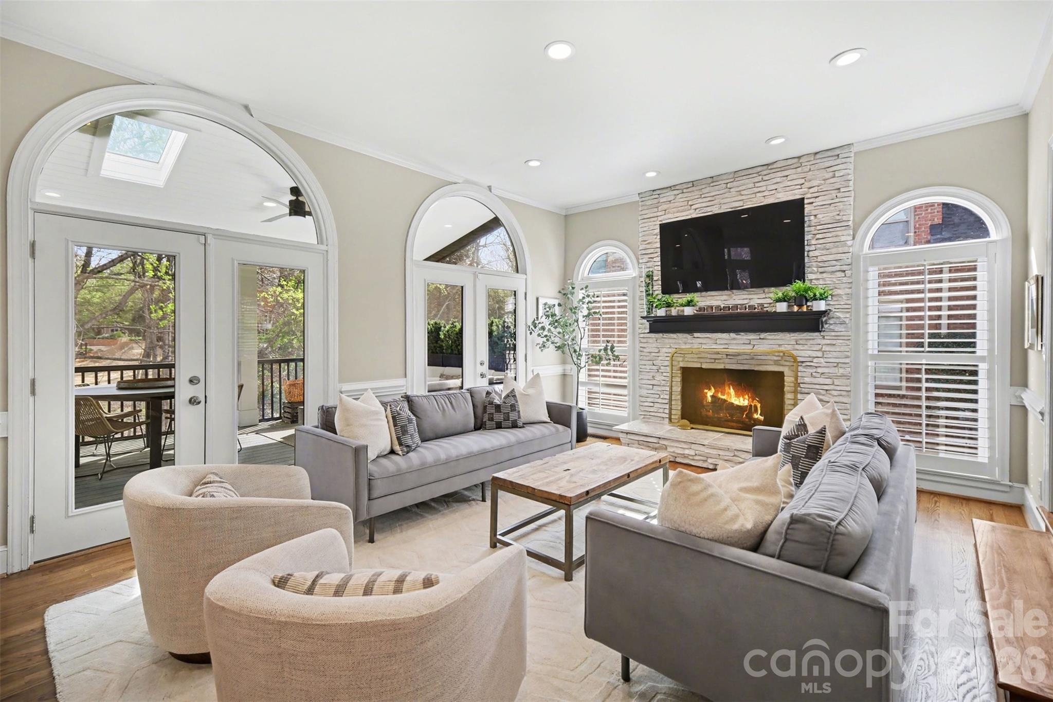 6008 Alexa Road Charlotte, NC 28277 - Photo 15 of 46 a living room with furniture fireplace and flat screen tv