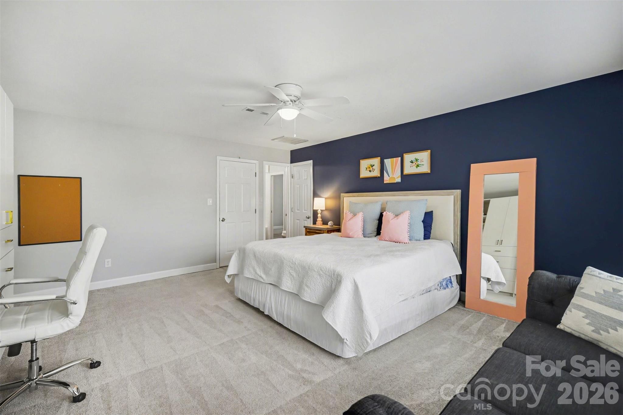 6008 Alexa Road Charlotte, NC 28277 - Photo 26 of 46 a spacious bedroom with a bed and a chair