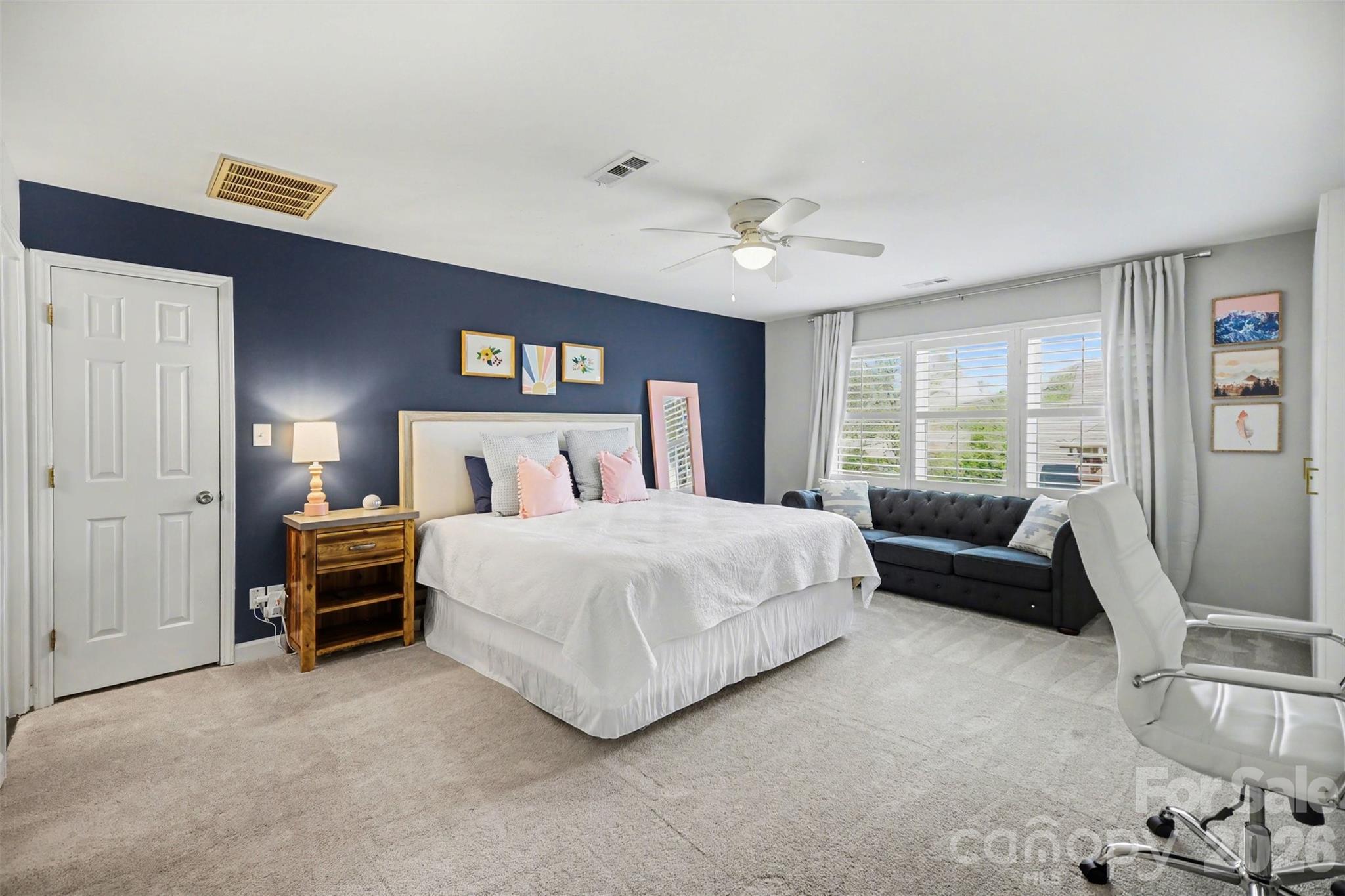 6008 Alexa Road Charlotte, NC 28277 - Photo 27 of 46 a bedroom with a bed couch and a window