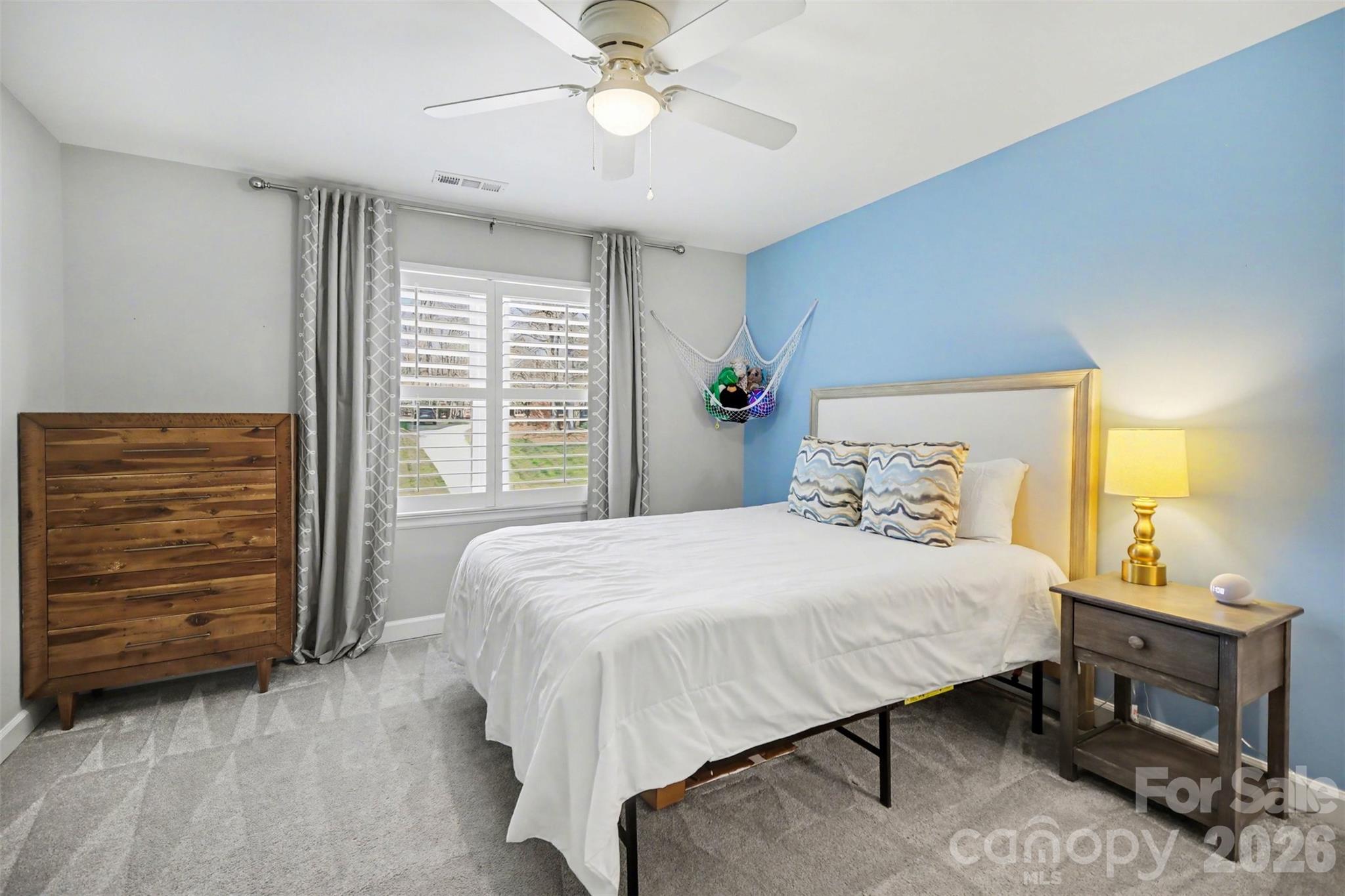 6008 Alexa Road Charlotte, NC 28277 - Photo 30 of 46 a bedroom with a bed a dresser and with closet