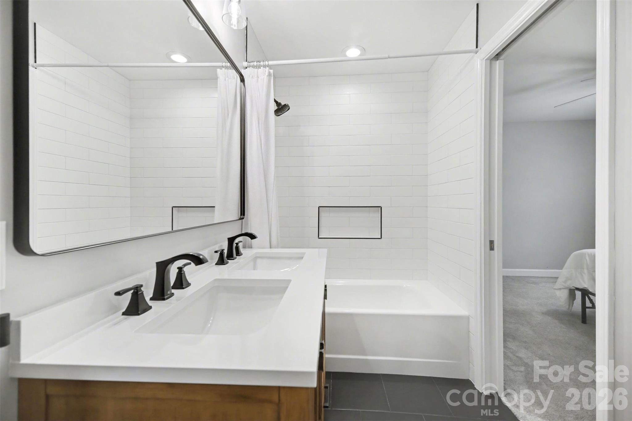 6008 Alexa Road Charlotte, NC 28277 - Photo 32 of 46 a bathroom with a sink and a mirror