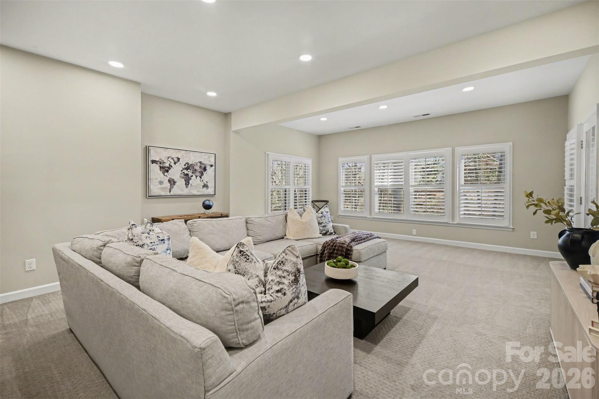 6008 Alexa Road Charlotte, NC 28277 - Photo 33 of 46 a living room with furniture and a window