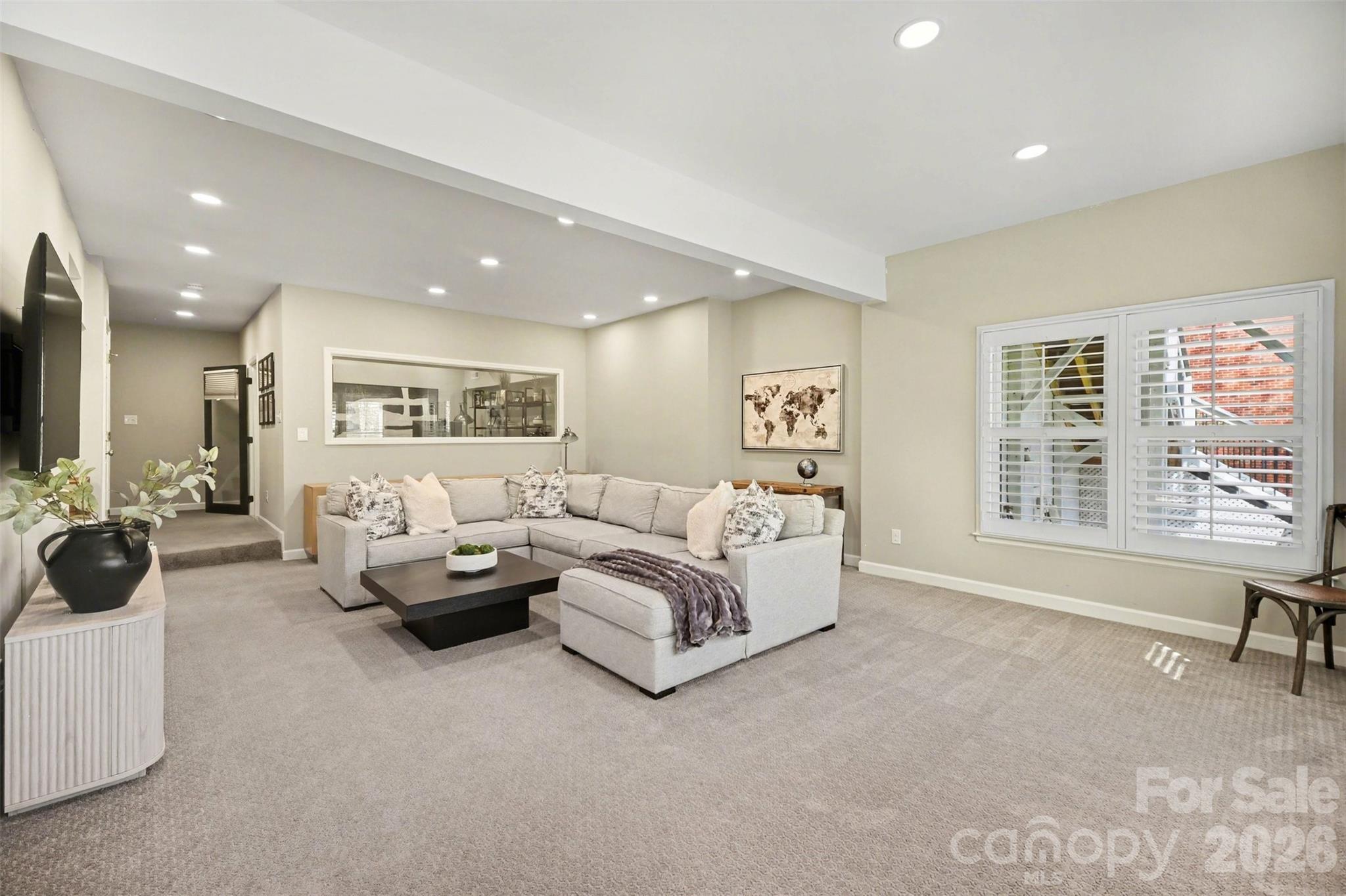 6008 Alexa Road Charlotte, NC 28277 - Photo 34 of 46 a living room with furniture and a large window