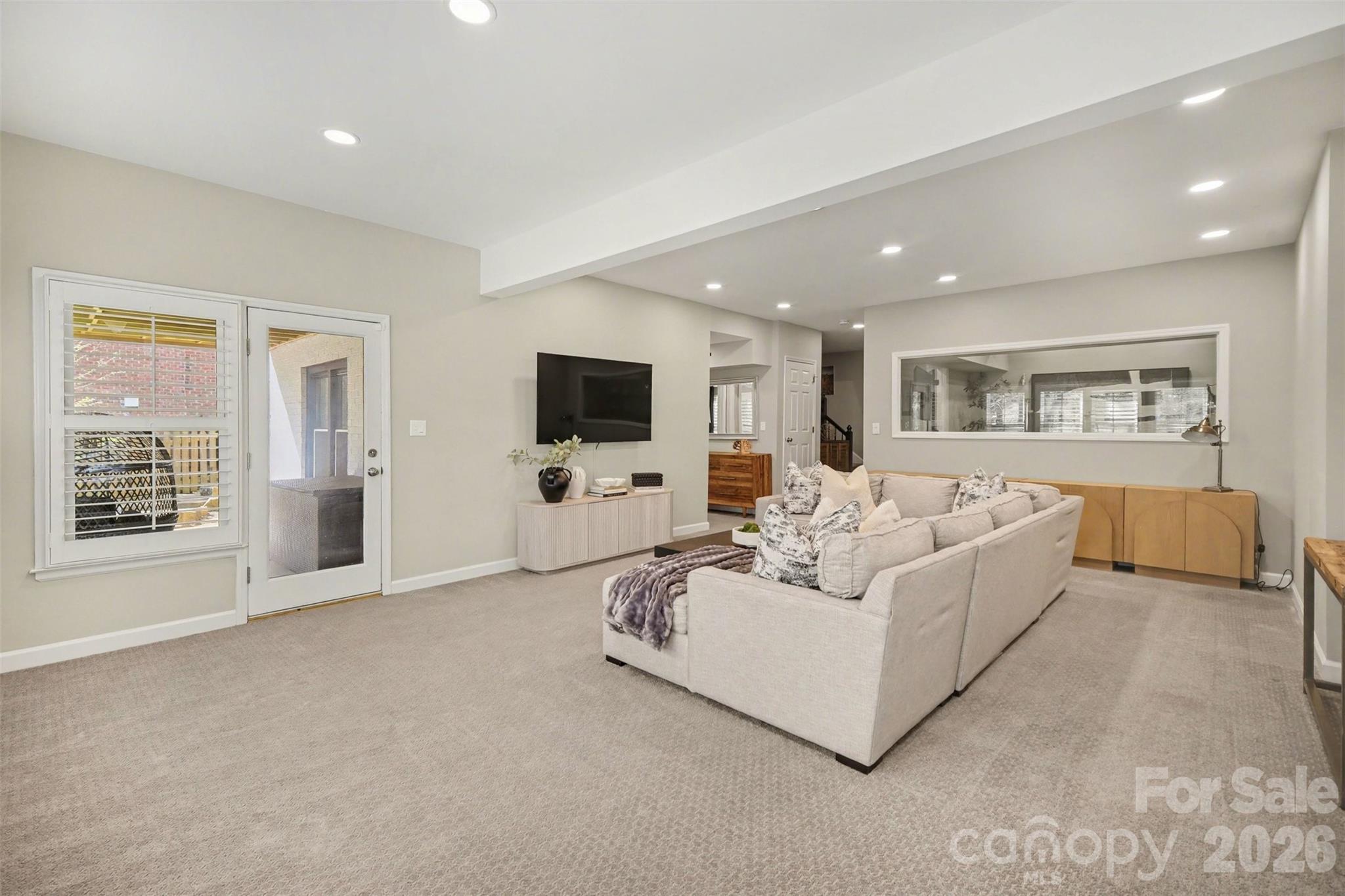 6008 Alexa Road Charlotte, NC 28277 - Photo 35 of 46 a living room with furniture and a flat screen tv