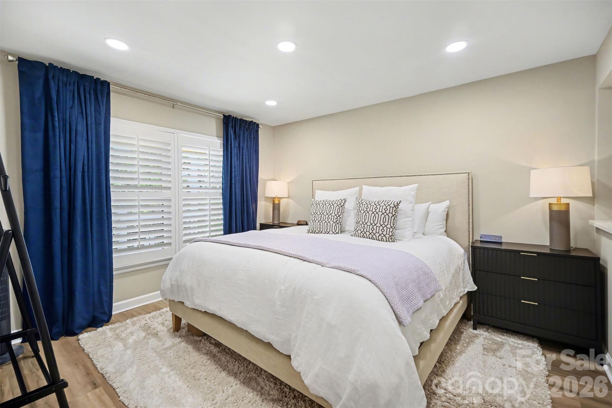 6008 Alexa Road Charlotte, NC 28277 - Photo 37 of 46 a bedroom with a bed and a night stand